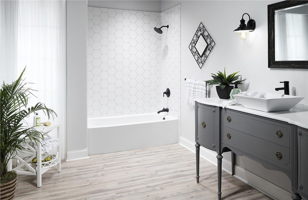 White hexagon tile look shower with a matte black fixture