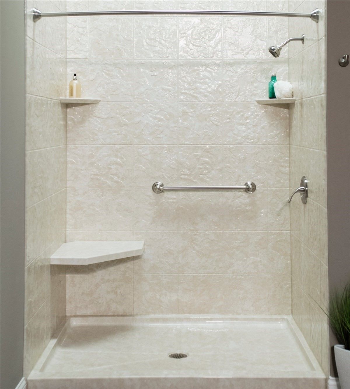 Barrier free walk in shower with a built in seat and grab bars