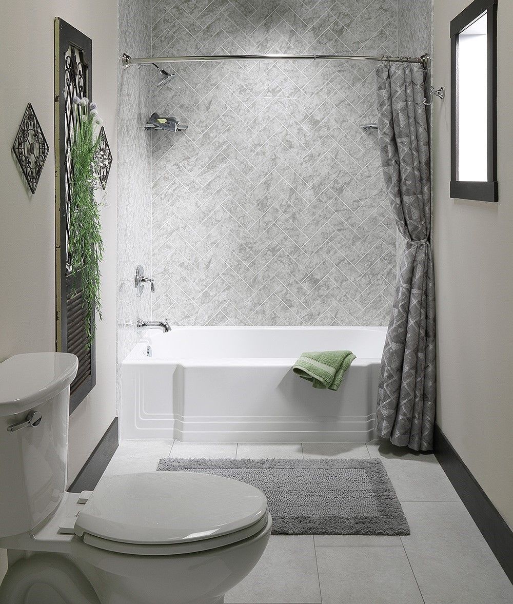 Replacement bathtub with a marble look wall surround and curtain rod