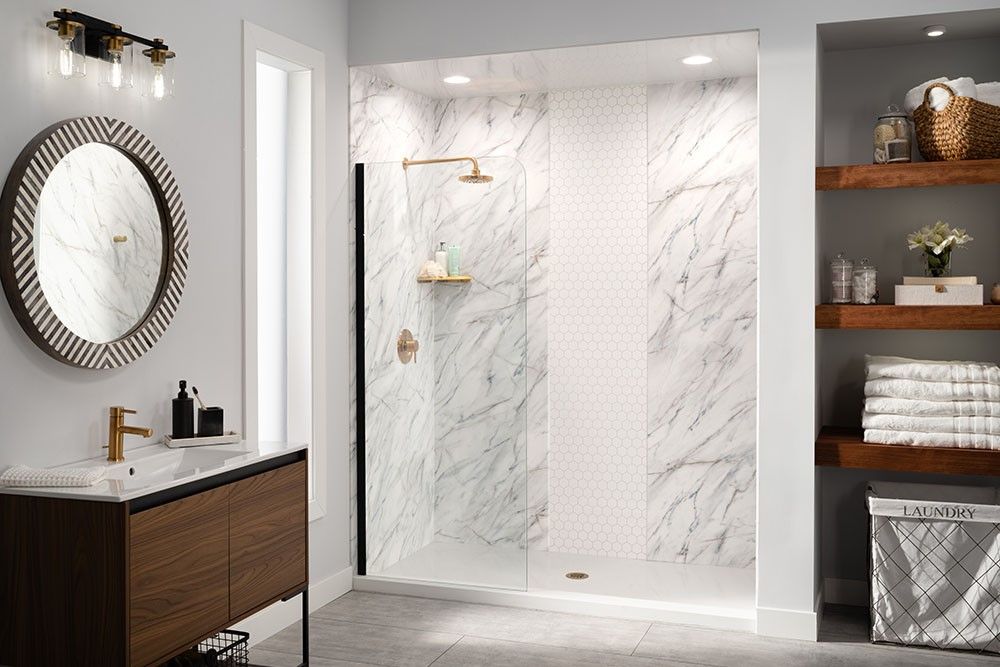 Walk in shower with marble look walls installed where a bathtub used to be