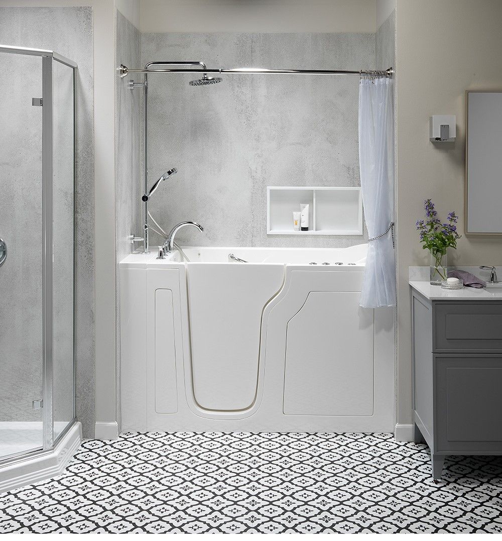 Walk in tub with a low step door and built in seat