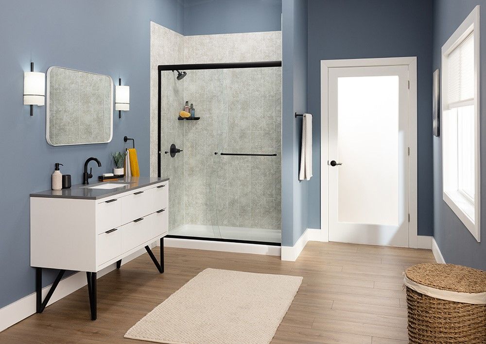 Modern Spokane bathroom with a black framed glass shower and a floating white vanity